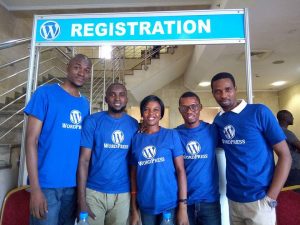 Akinde volunteering at a Tech Event  